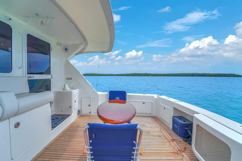  Yacht Photos Pics 2008 Riviera 51 Enclosed Bridge yacht deck with ocean view and clear skies.