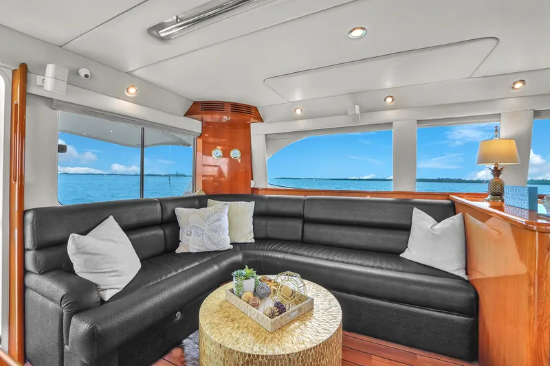  Yacht Photos Pics Luxurious interior of 2008 Riviera 51 Enclosed Bridge yacht with ocean view.