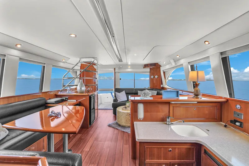  Yacht Photos Pics Luxurious interior of 2008 Riviera 51 Enclosed Bridge yacht with ocean view.