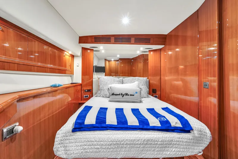  Yacht Photos Pics Luxurious cabin interior of 2008 Riviera 51 Enclosed Bridge yacht with cozy bedding.