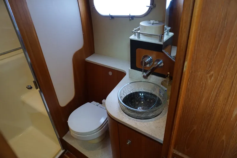 The Pearl Yacht Photos Pics Luxurious 2007 Tiara Yachts 3900 Sovran bathroom with glass sink and modern fixtures.