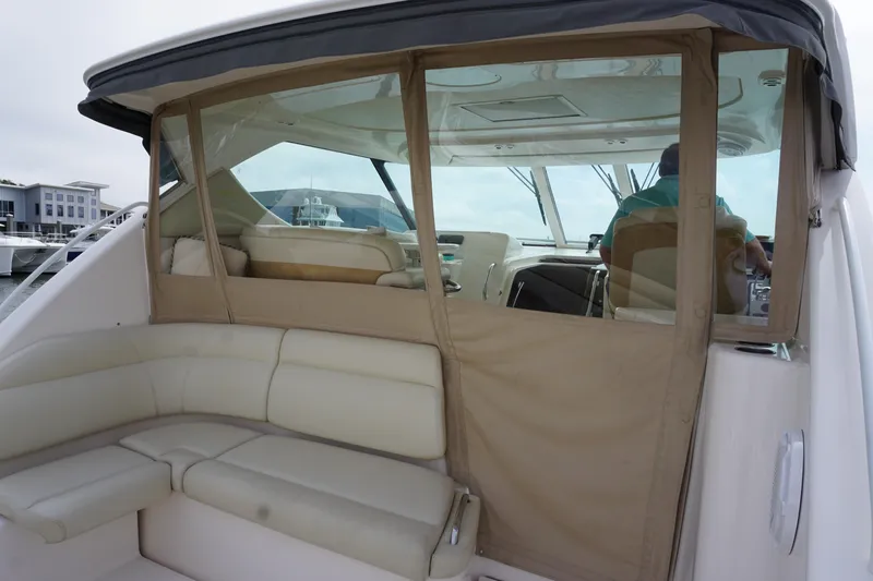 The Pearl Yacht Photos Pics 2007 Tiara Yachts 3900 Sovran interior with beige seating and clear enclosure.