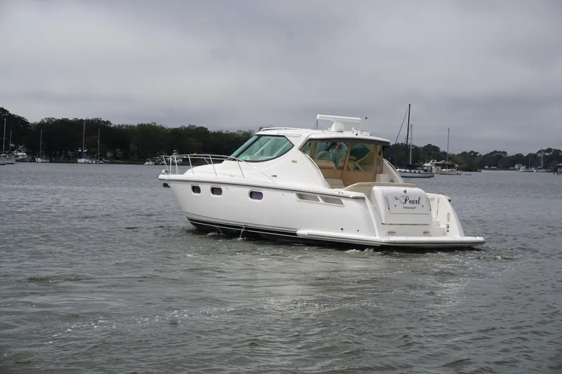 The Pearl Yacht Photos Pics 2007 Tiara Yachts 3900 Sovran cruising on a calm waterway.