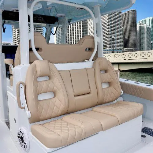  Yacht Photos Pics Luxurious seating on a 2026 Freeman 35 boat, with cityscape in the background.