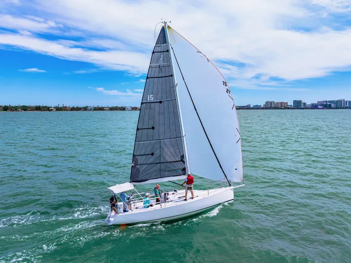 Encore Yacht Photos Pics 2011 J Boats J/95 sailing on open water under a clear blue sky.