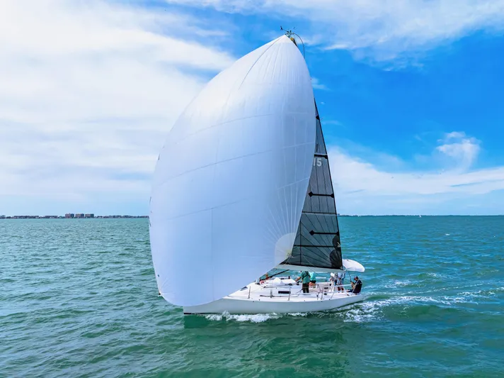 Encore Yacht Photos Pics 2011 J Boats J/95 sailing on open water under a clear blue sky.