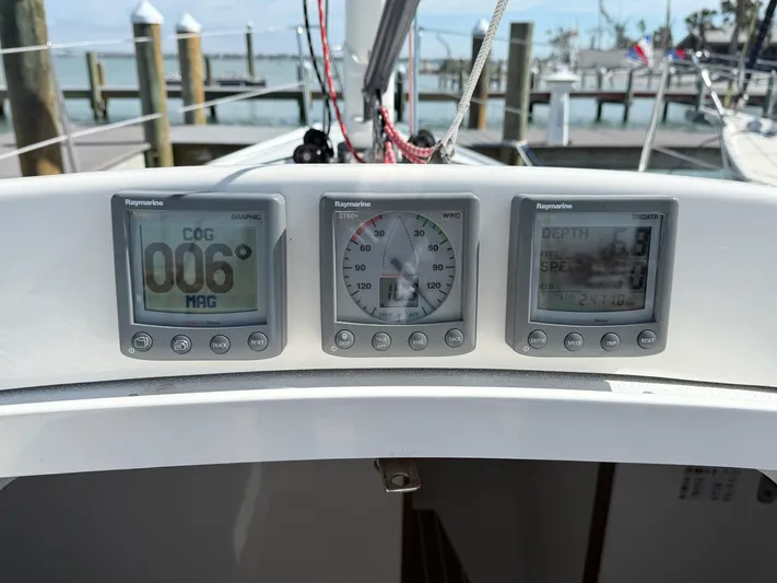 Encore Yacht Photos Pics 2011 J Boats J/95 sailboat cockpit with navigation instruments displaying course, speed, and depth.
