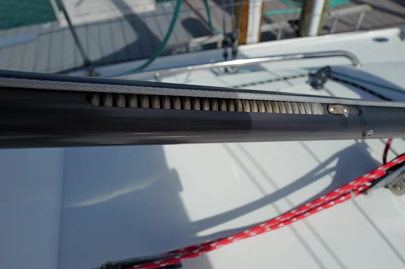 Encore Yacht Photos Pics Close-up of a 2011 J Boats J/95 sailboat's boom with rigging details.