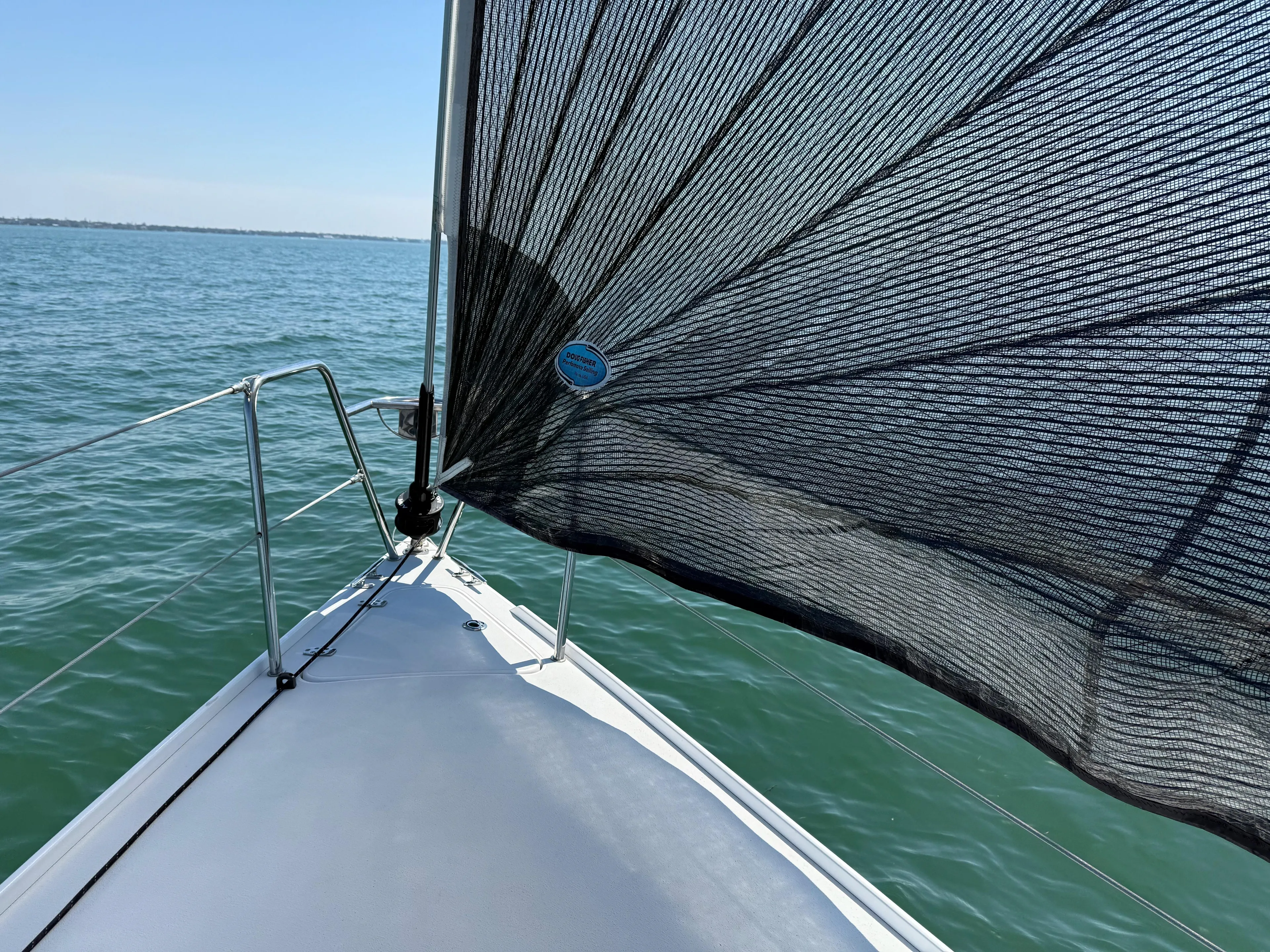 Encore Yacht Photos Pics 2011 J Boats J/95 sailboat on calm water with black sail.