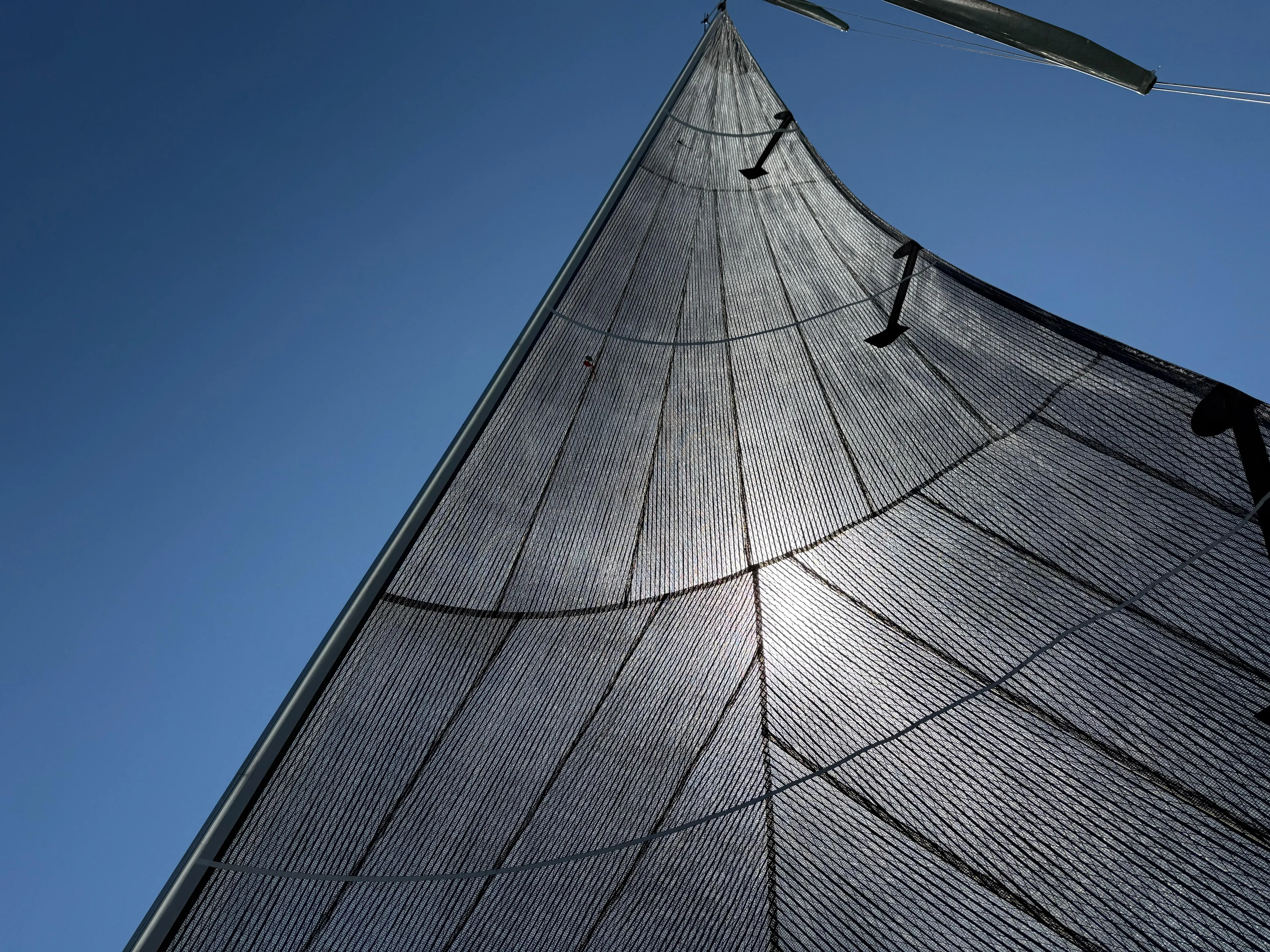 Encore Yacht Photos Pics Sail of 2011 J Boats J/95 against clear blue sky.