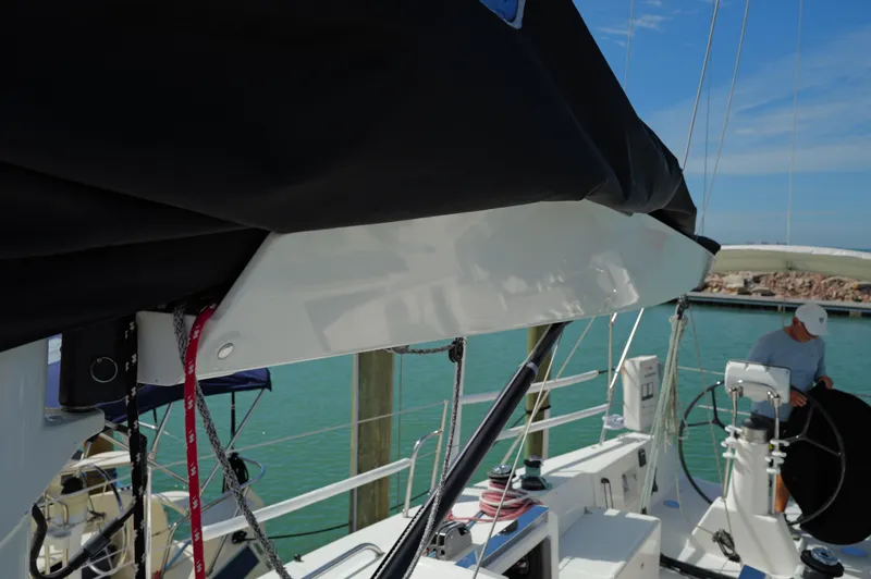 Encore Yacht Photos Pics 2011 J Boats J/95 sailboat deck with rigging and helm, docked in a marina.