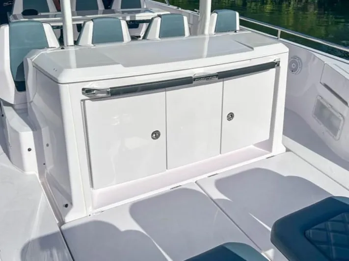  Yacht Photos Pics 2024 Axopar 37 Sun Top boat interior with sleek white cabinetry.