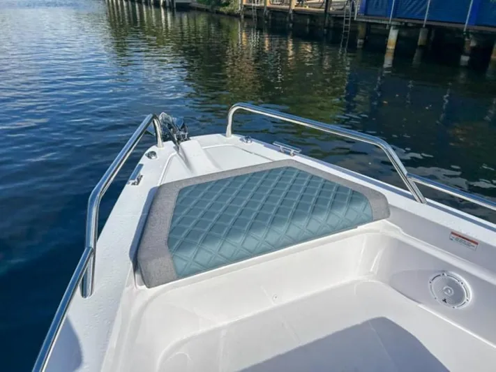  Yacht Photos Pics 2024 Axopar 37 Sun Top bow seating area on calm water.