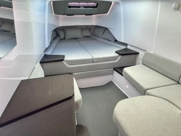  Yacht Photos Pics Luxurious interior cabin of the 2024 Axopar 37 Sun Top with modern grey upholstery.