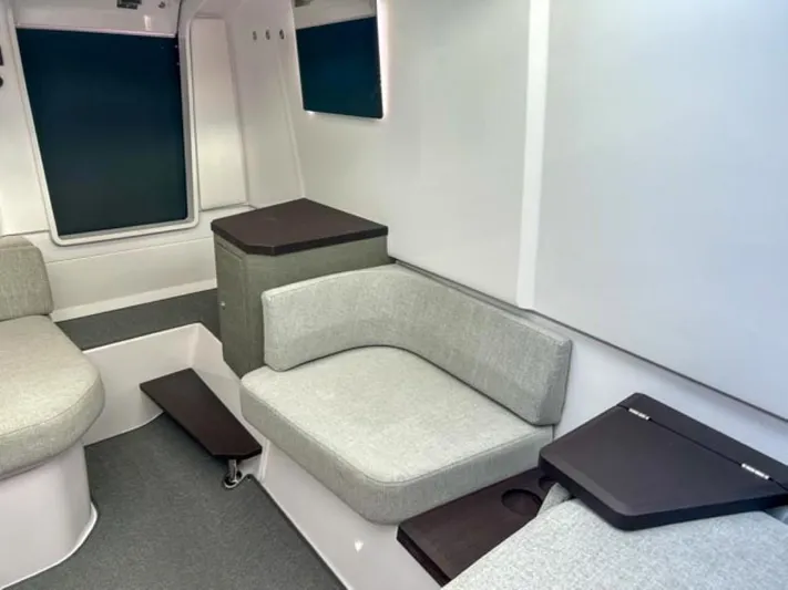  Yacht Photos Pics Interior of 2024 Axopar 37 Sun Top, featuring modern seating and sleek design.