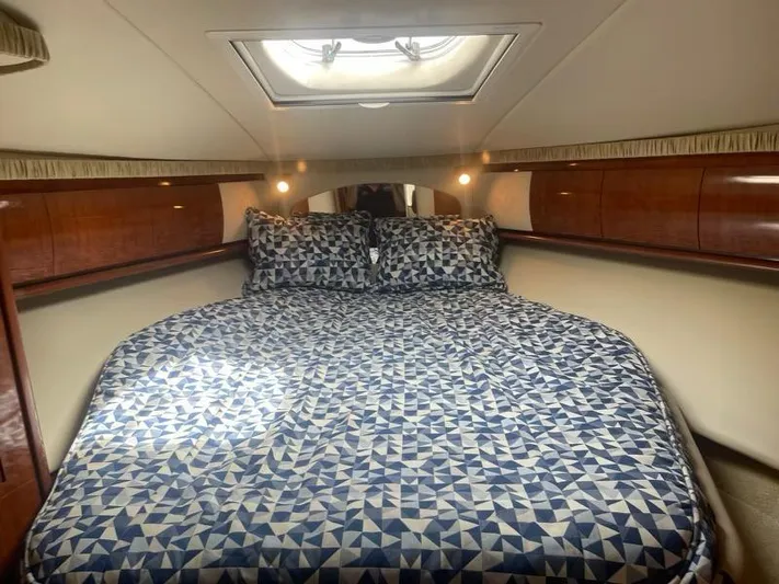 Lucky Duck Yacht Photos Pics Luxurious cabin interior of 2005 Sea Ray 420 Sundancer yacht with patterned bedding.
