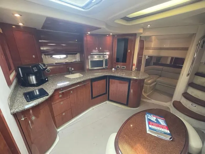 Lucky Duck Yacht Photos Pics Luxurious 2005 Sea Ray 420 Sundancer yacht interior with modern kitchen and seating area.