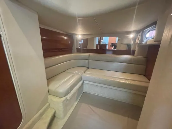 Lucky Duck Yacht Photos Pics Luxurious interior of 2005 Sea Ray 420 Sundancer yacht with beige leather seating.
