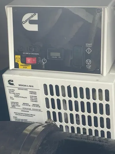 Lucky Duck Yacht Photos Pics Cummins generator control panel on 2005 Sea Ray 420 Sundancer yacht.
