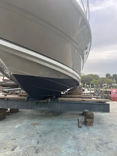 Lucky Duck Yacht Photos Pics 2005 Sea Ray 420 Sundancer yacht on dry dock, showcasing hull design.