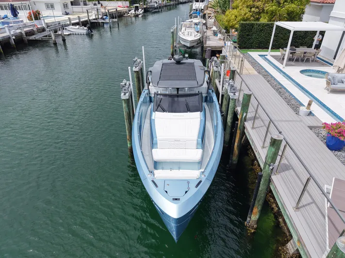 Chin Don Yacht Photos Pics Luxury Limitless Seas 45 XLV yacht docked in a serene marina, 2023 model.