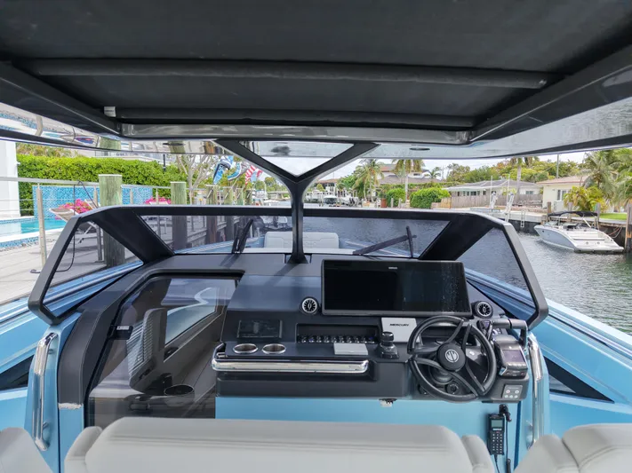 Chin Don Yacht Photos Pics Interior view of 2023 Limitless Seas 45 XLV yacht cockpit with modern controls.
