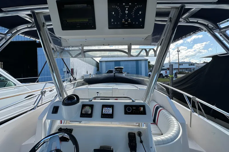  Yacht Photos Pics Cockpit view of a 1999 Intrepid 339 boat with modern navigation instruments.