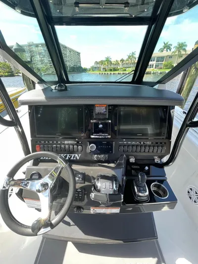  Yacht Photos Pics 2019 Blackfin 272 CC boat dashboard with steering wheel and navigation controls.