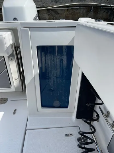 Yacht Photos Pics 2019 Blackfin 272 CC boat interior with open storage compartment.