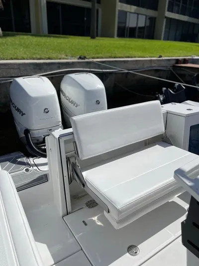  Yacht Photos Pics 2019 Blackfin 272 CC boat with dual Mercury engines and white seating.