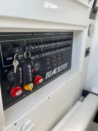  Yacht Photos Pics Control panel of a 2019 Blackfin 272 CC boat with keys inserted.