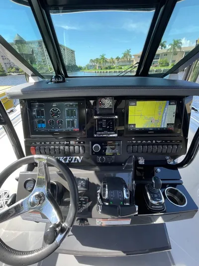  Yacht Photos Pics 2019 Blackfin 272 CC boat dashboard with navigation screens and controls.