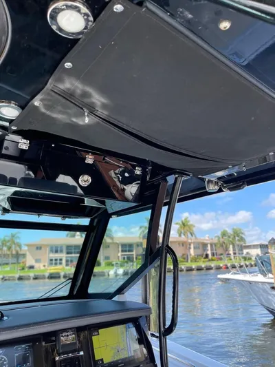  Yacht Photos Pics 2019 Blackfin 272 CC boat interior with modern dashboard and waterfront view.