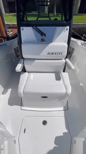  Yacht Photos Pics 2019 Blackfin 272 CC boat interior with white seating and console.