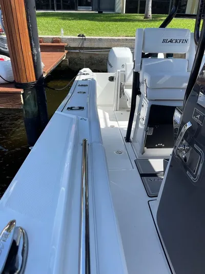  Yacht Photos Pics 2019 Blackfin 272 CC boat docked, showcasing sleek design and modern features.