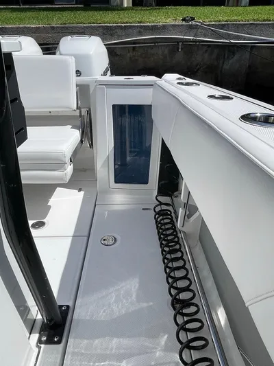  Yacht Photos Pics 2019 Blackfin 272 CC boat interior with seating and storage compartments.