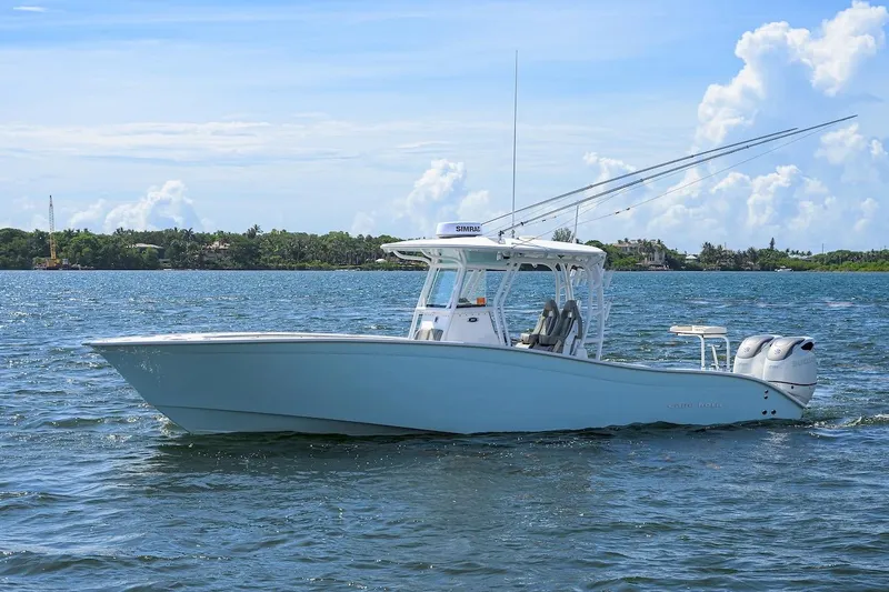  Yacht Photos Pics 2024 Cape Horn 31 T boat on calm water under a clear blue sky.