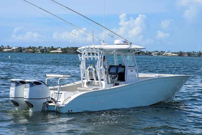  Yacht Photos Pics 2024 Cape Horn 31 T boat on water, featuring dual Suzuki engines, clear sky background.
