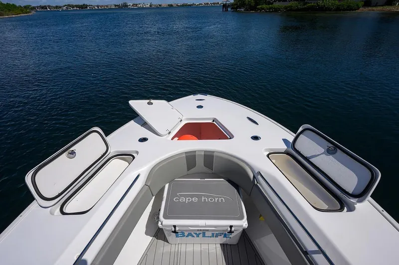  Yacht Photos Pics 2024 Cape Horn 31 T boat deck with open storage compartments on calm water.