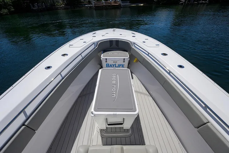  Yacht Photos Pics 2024 Cape Horn 31 T boat interior with seating and cooler on calm water.
