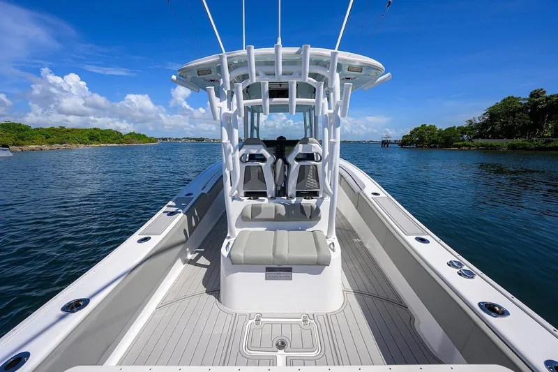  Yacht Photos Pics 2024 Cape Horn 31 T boat on calm water, showcasing sleek design and spacious deck.