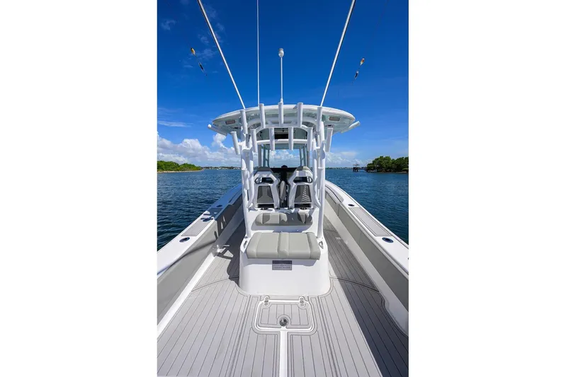  Yacht Photos Pics 2024 Cape Horn 31 T boat on calm water, showcasing sleek design and spacious deck.