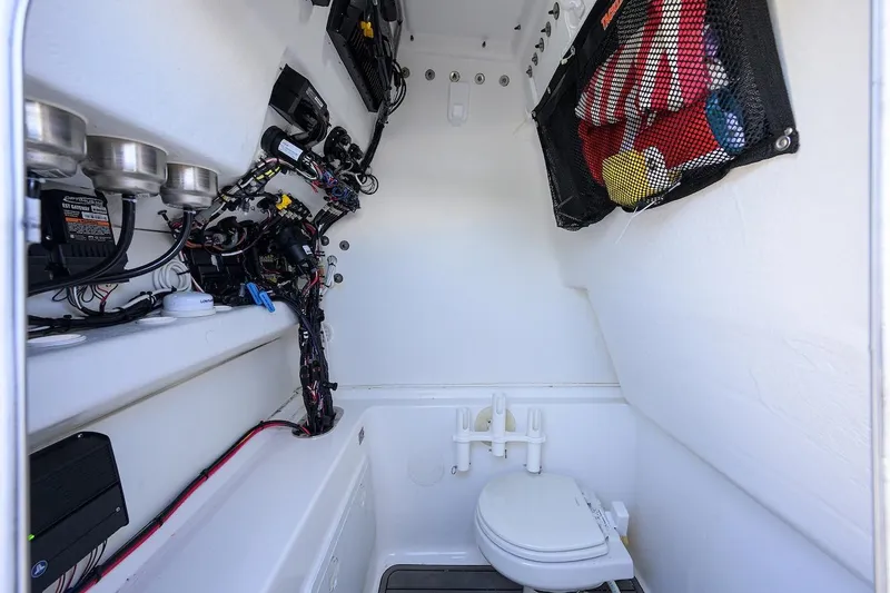  Yacht Photos Pics 2024 Cape Horn 31 T boat interior with toilet and storage net.