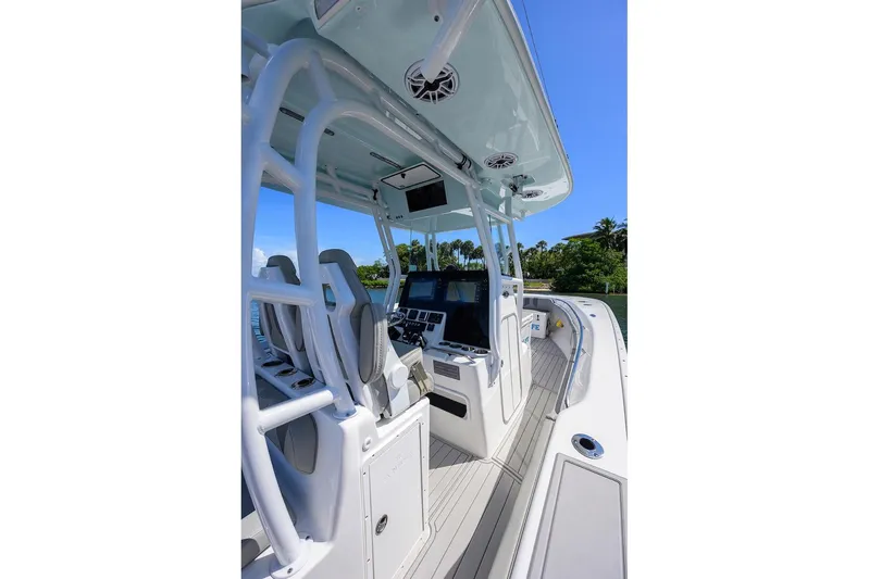  Yacht Photos Pics 2024 Cape Horn 31 T boat interior with modern helm and seating, under clear blue sky.