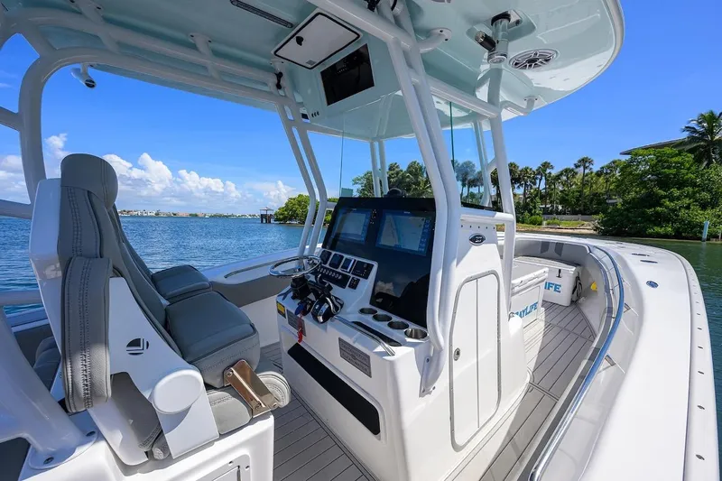  Yacht Photos Pics 2024 Cape Horn 31 T boat interior with modern helm and seating, on a sunny day.