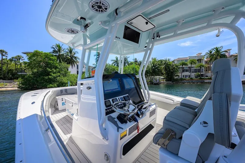  Yacht Photos Pics 2024 Cape Horn 31 T boat interior with modern helm, luxurious seating, and waterfront view.