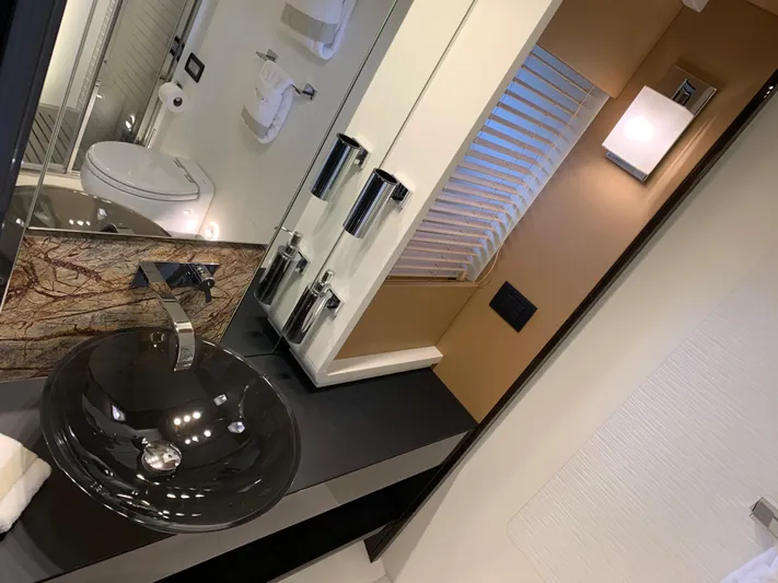 Fantastic Yacht Photos Pics Luxurious bathroom in a 2019 Azimut 77S yacht with modern fixtures.