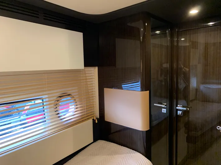 Fantastic Yacht Photos Pics Luxurious interior cabin of 2019 Azimut 77S yacht with modern design and porthole window.