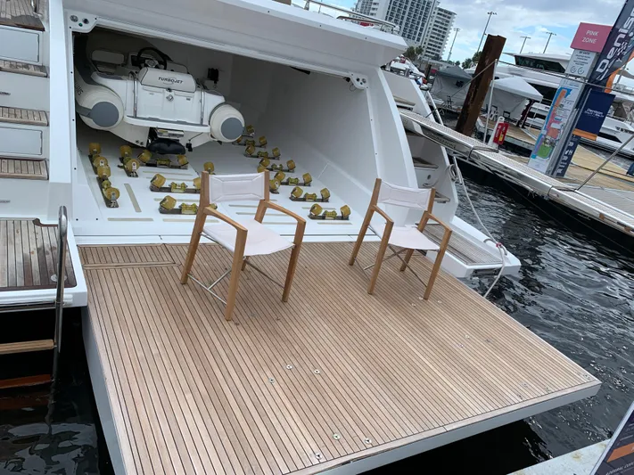Fantastic Yacht Photos Pics 2019 Azimut 77S yacht with open garage and two chairs on the deck.