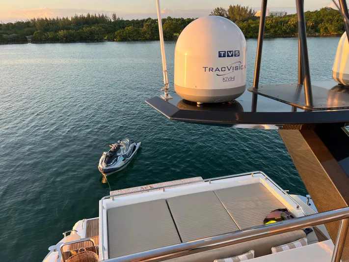 Fantastic Yacht Photos Pics 2019 Azimut 77S yacht with TracVision TV5 satellite, jet ski in water.